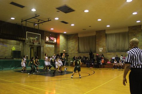 Senior Bianca Perez shoots the ball against Hoboken Charter as senior Jazmine Doran looks on. The Lady Generals won their Senior Night game February 10.