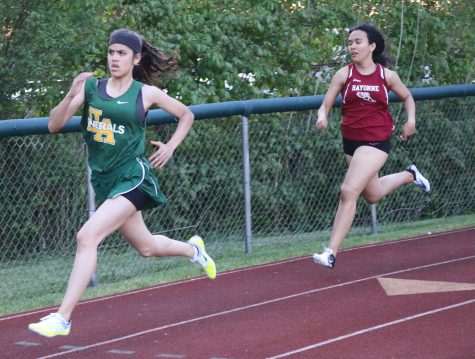 Freshmen Michael Tapalla (top) and Tiffany Ortiz (bottom) run in the 400-meter at the Husdon County Track Coach Association Championships. The freshmen have been a highlight of the spring track season. Photo by Angel Guzman