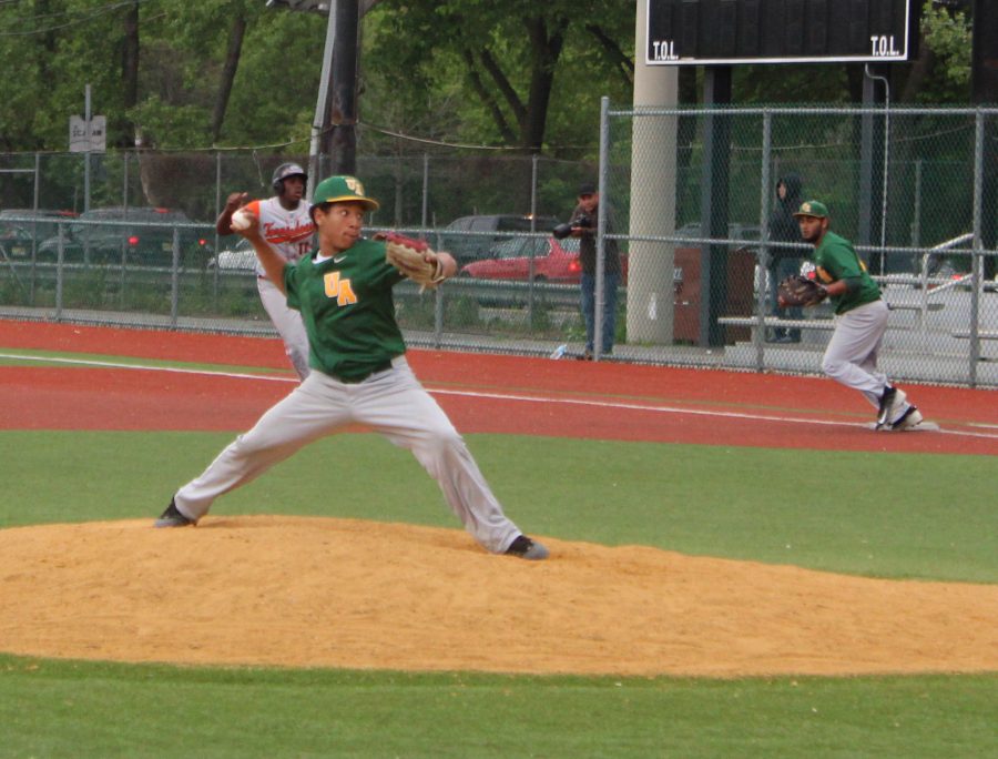 Sophomore+Joshua+Leonardo+pitches+against+as+sophomore+Derek+Santiago+looks+on+from+first+base.+Underclassmen+have+had+to+step+up+this+season%2C+after+the+departure+of+several+potential+starters.+Photo+by+Brandyn+Rampersad