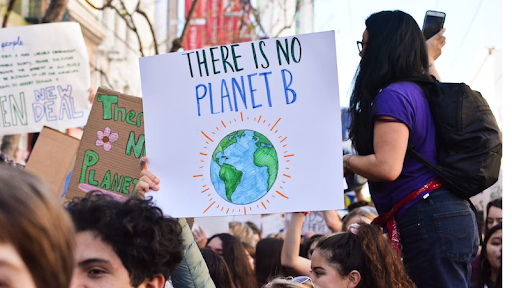 A sign at a global warming protest let’s everyone know we only have one planet. 
