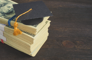 A student graduating with many different scholarships 
Photo credit: Unsplash