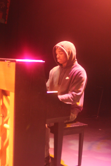  Musical prodigy Dion Mitchell playing the piano at the Black History Month showcase.



