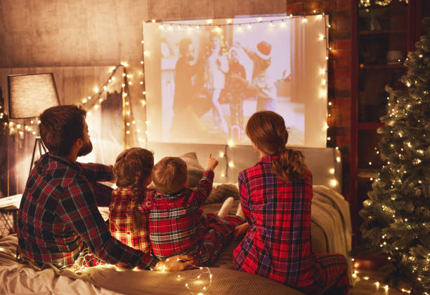  A family enjoying a movie on Christmas.
