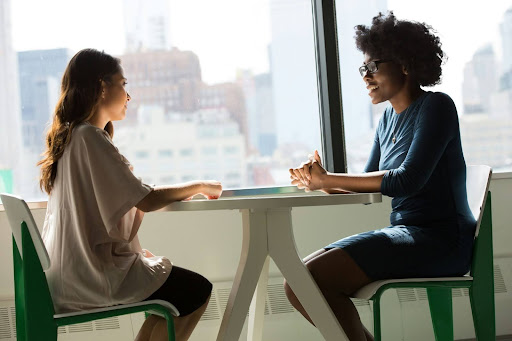 Two adults having a conversation.
